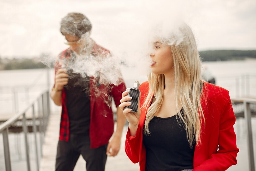 stylish-young-couple-with-vape-city